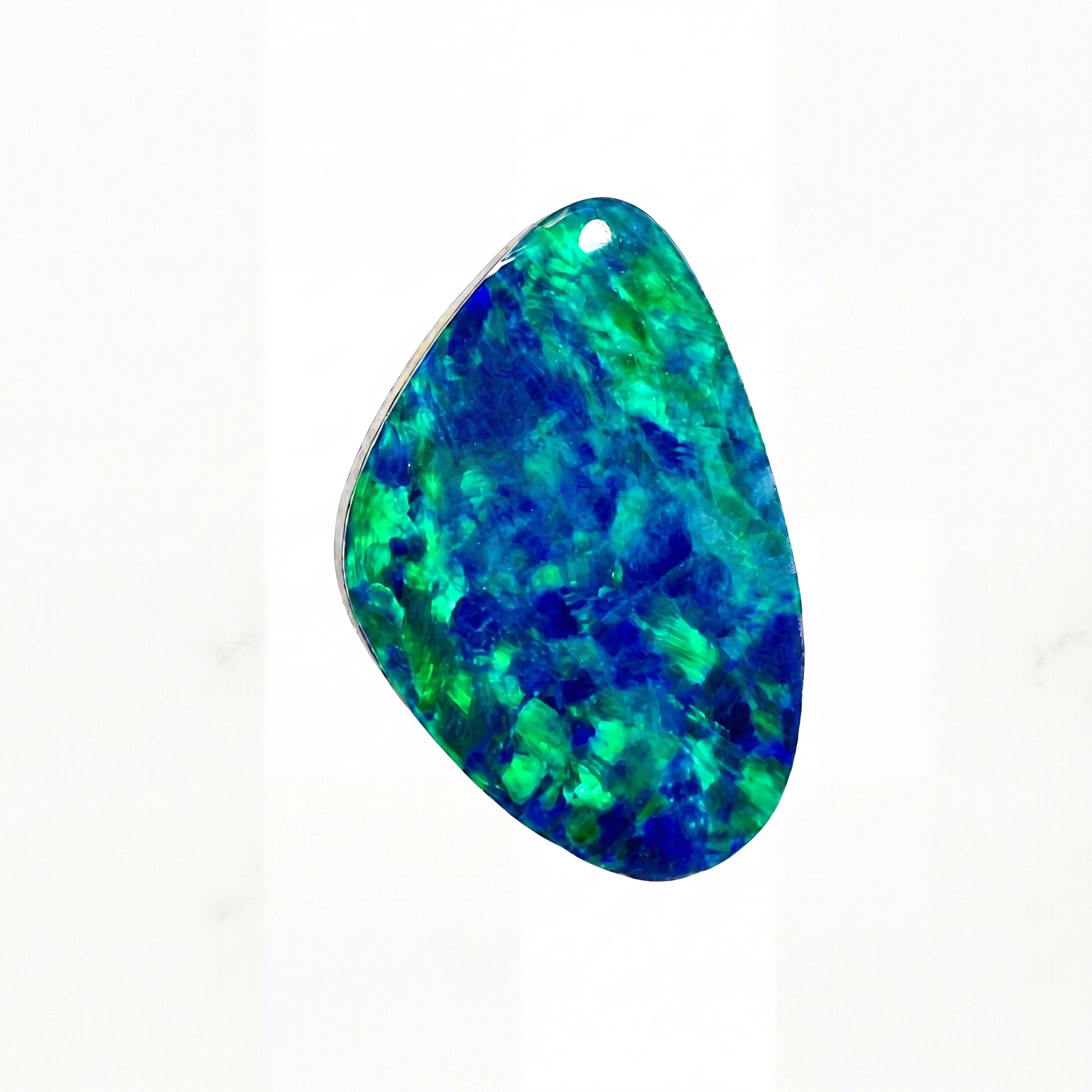 A teardrop-shaped natural opal gemstone pendant with vibrant blue and green iridescent play-of-colour, shown on a clean white background.