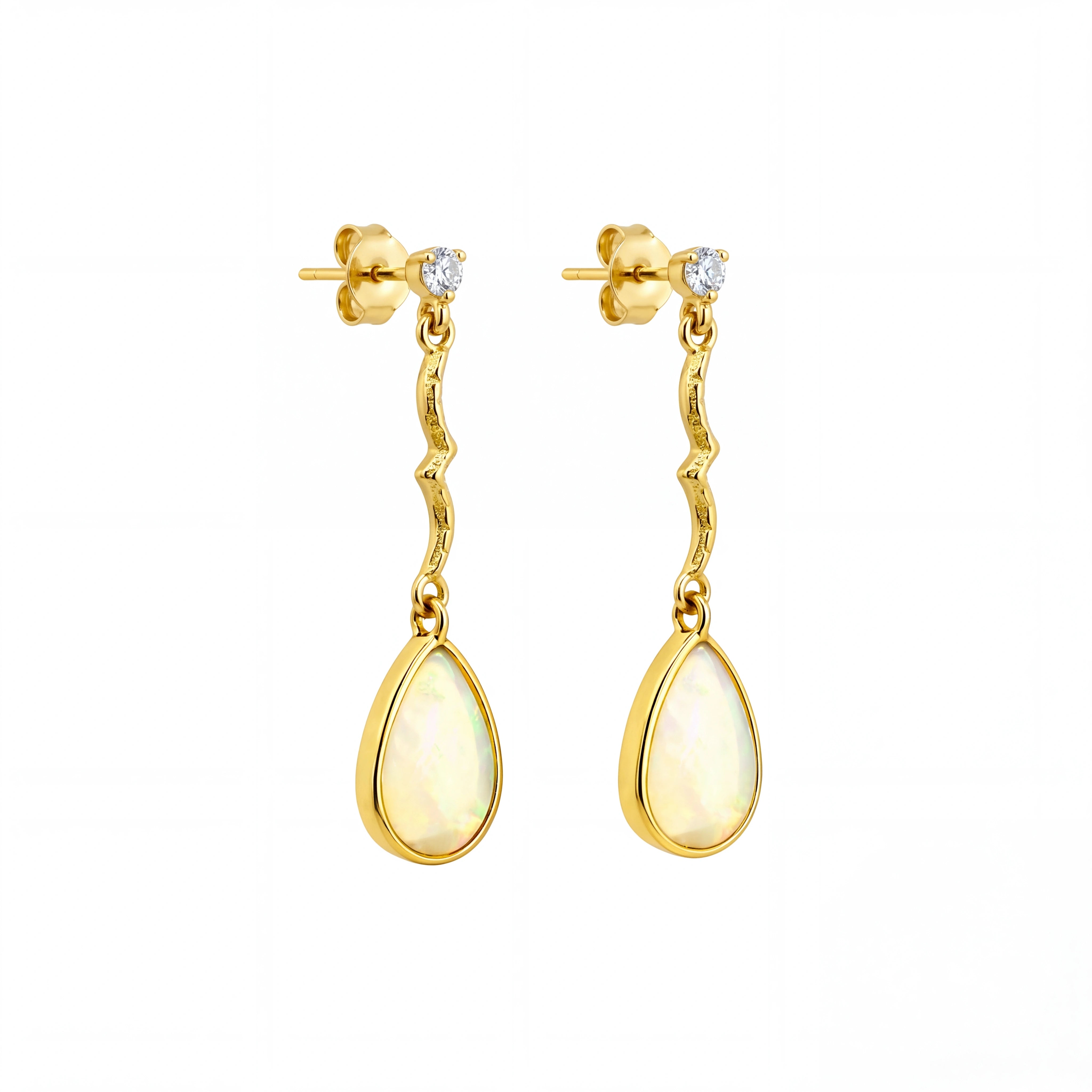 Gold earrings with teardrop-shaped yellow gemstones on a white background