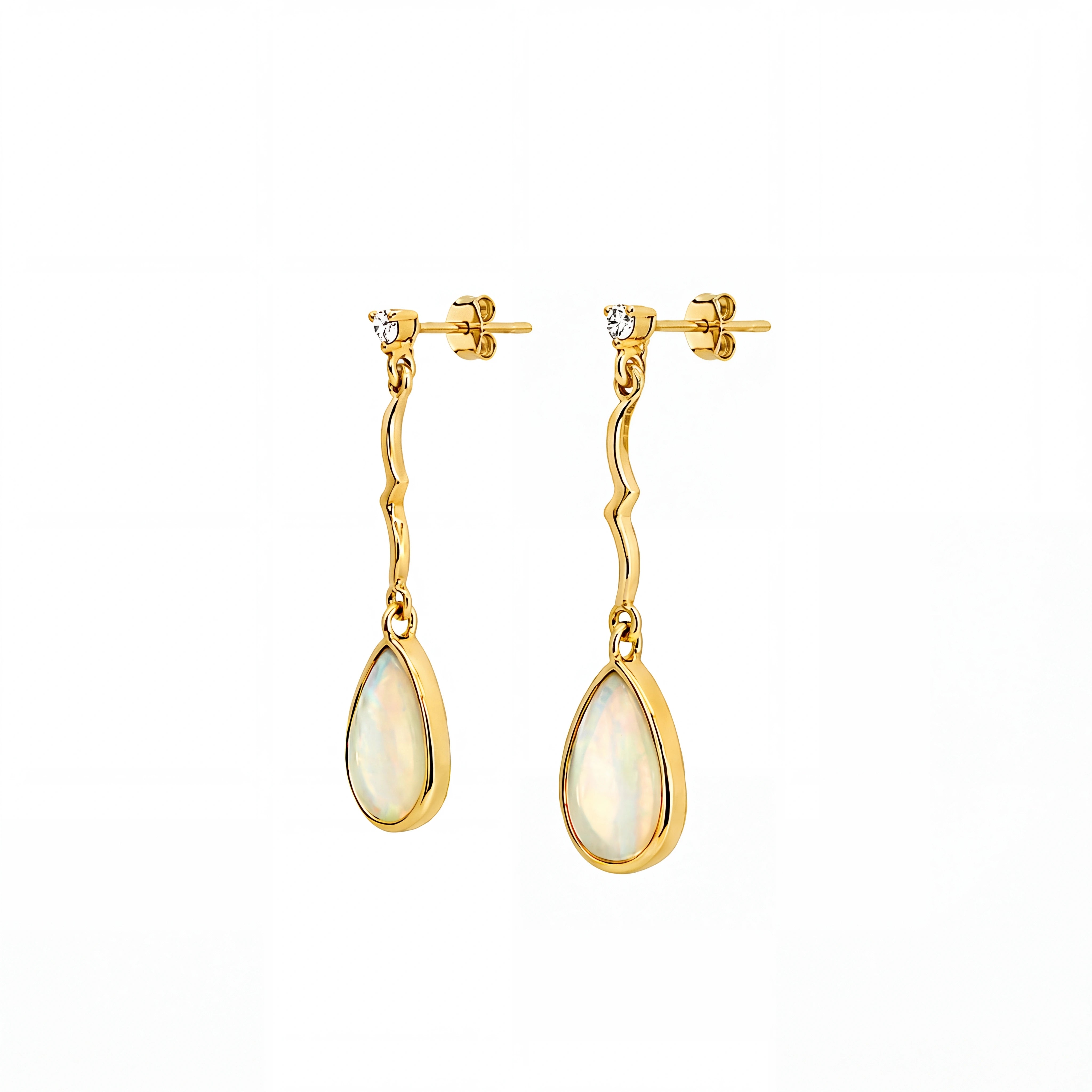 Gold earrings with teardrop-shaped stones on a white background