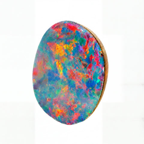 A round cabochon gemstone featuring a vibrant, multicoloured play-of-colour pattern with blue, green, pink, orange, and purple hues, set in a gold-toned bezel against a white background.