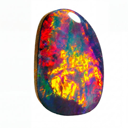 A single teardrop-shaped decorative tile or coaster featuring a vibrant, multicoloured tie-dye pattern of red, orange, blue, and black, isolated on a solid white background.