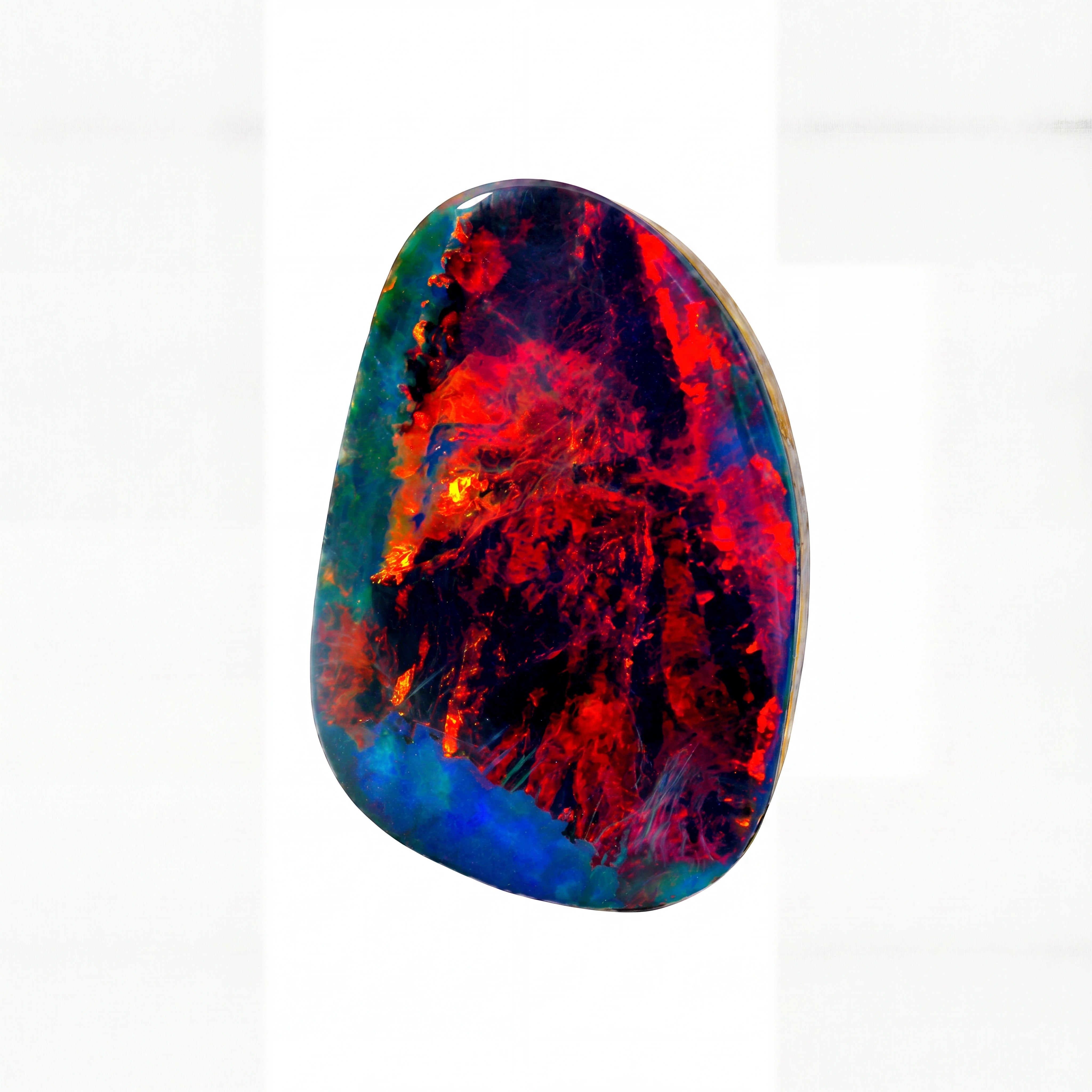 A polished natural opal stone with vibrant iridescent colours, featuring prominent red, blue, and green hues over a dark base, set against a plain white background.