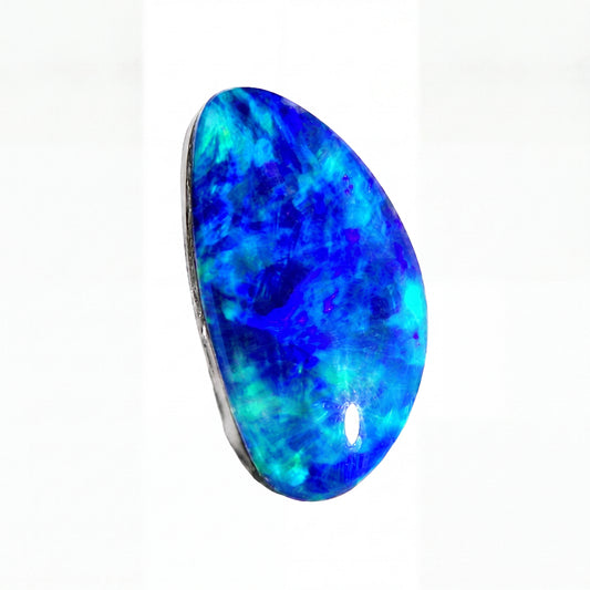A polished teardrop-shaped blue opal gemstone with vibrant blue, cyan, and purple marbling, set in a dark bezel on a plain white background.