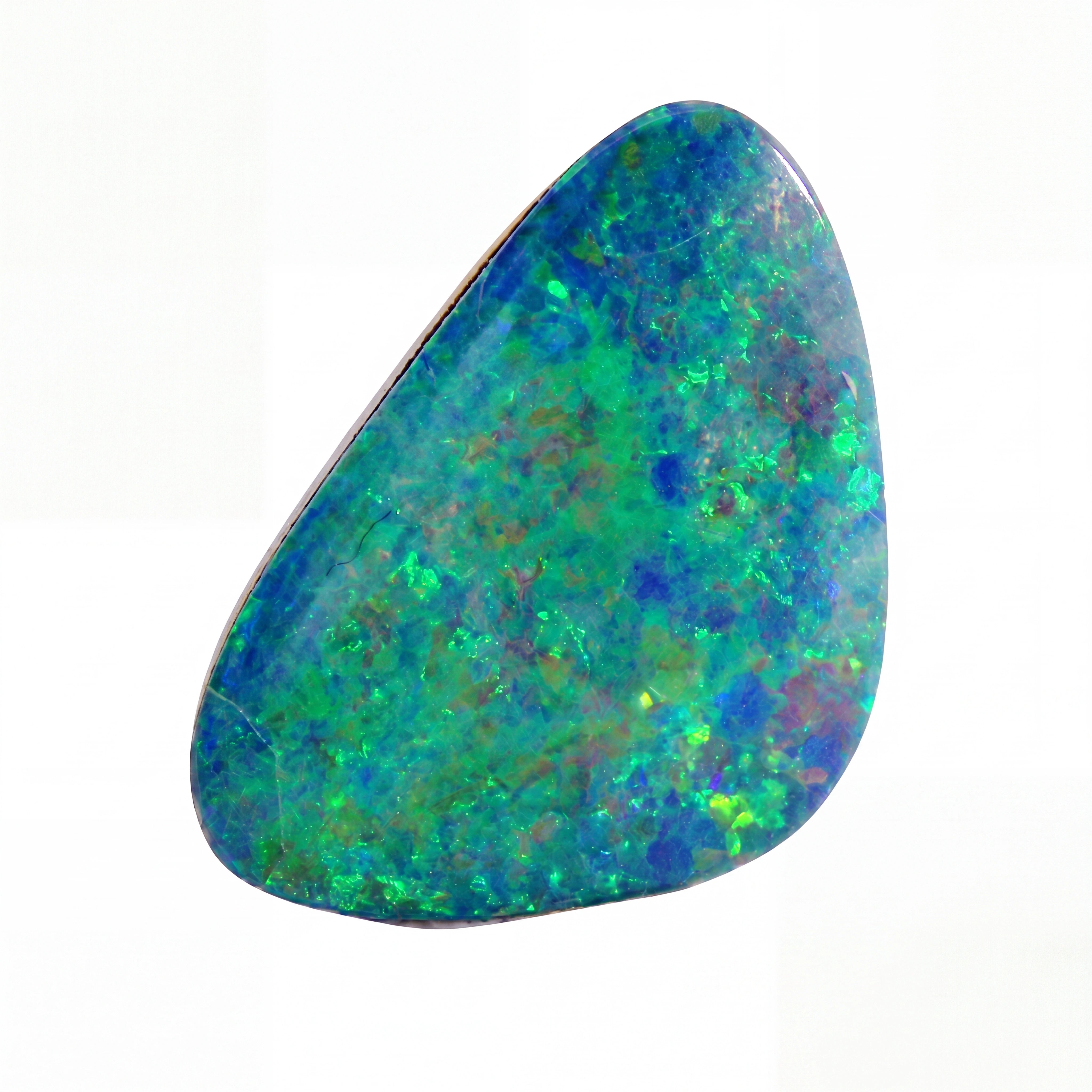 A polished irregular-shaped opal stone with a mottled play-of-colour pattern featuring blue, green, yellow, and orange on a white background.