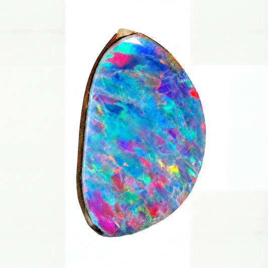 A teardrop-shaped natural opal gemstone with vibrant iridescent colours including blue, pink, purple, green, and red, set in a dark brown bezel on a white background.