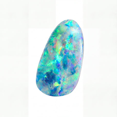 A polished teardrop-shaped cabochon opal gemstone displaying vibrant iridescent flashes of blue, green, purple, and yellow on a white background.