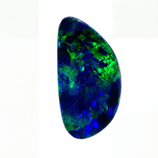 A polished teardrop-shaped boulder opal gemstone displaying vibrant flashes of green and blue over a dark blue base, set against a plain white background.