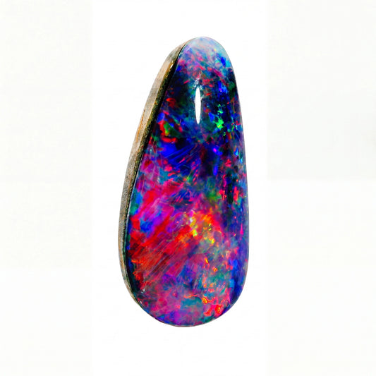 A teardrop-shaped cabochon opal gemstone displaying vibrant, swirling play-of-colour with blue, red, pink, green, and orange, set in a dark metal bezel on a white background.