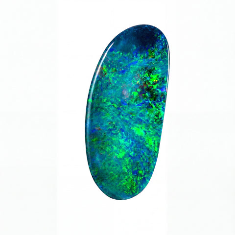A polished oval cabochon gemstone featuring a vibrant play-of-colour pattern with bright green, blue, and teal hues, set against a plain white background.