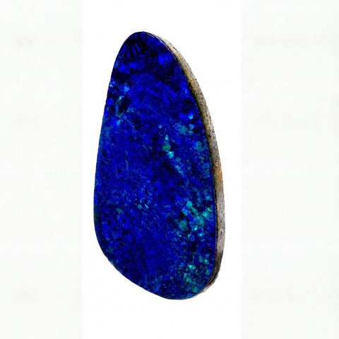 A polished natural opal stone cabochon with vibrant deep blue and teal matrix, set in a raw brownish-grey border, shown on a plain white background.