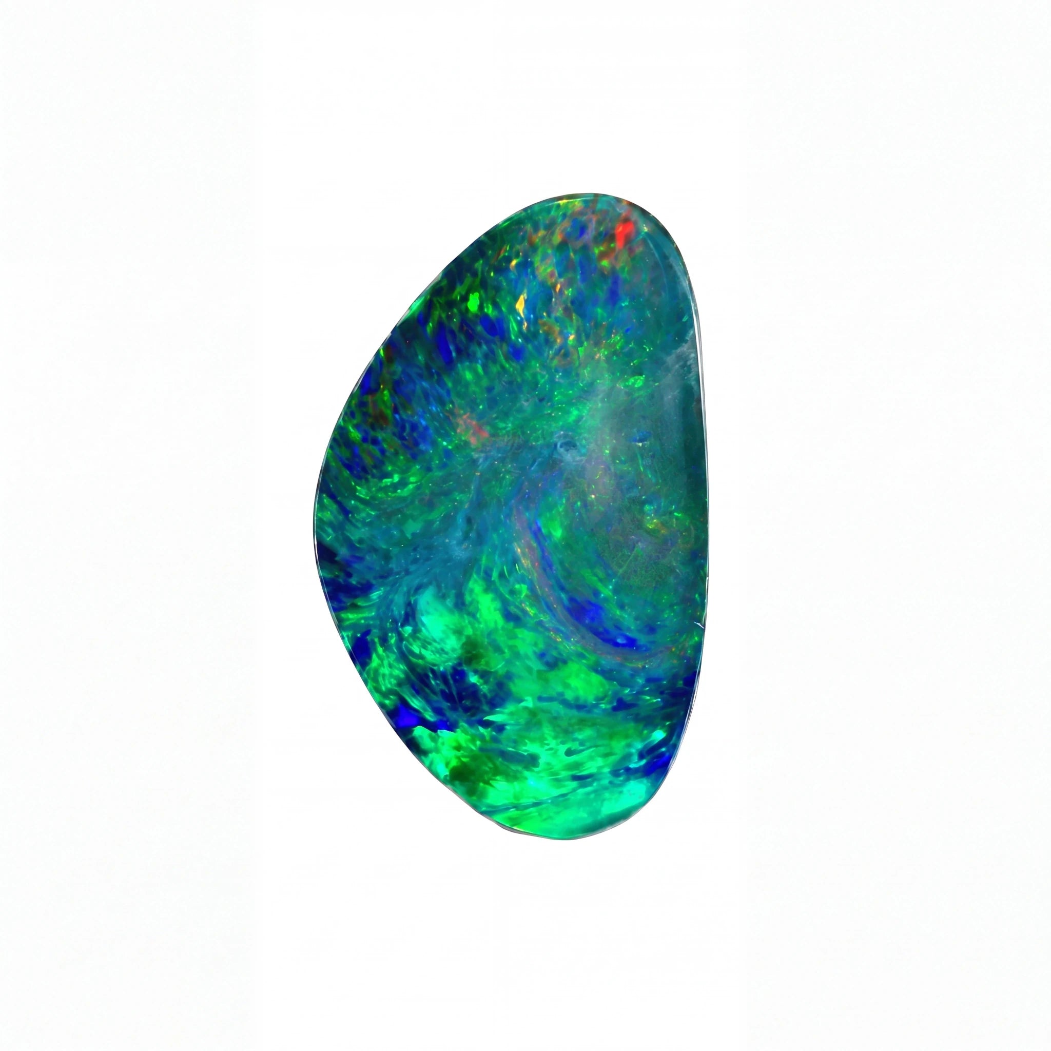 A polished irregular-shaped opal gemstone displaying vibrant iridescent colours including green, blue, and hints of orange and red, set against a plain white background.