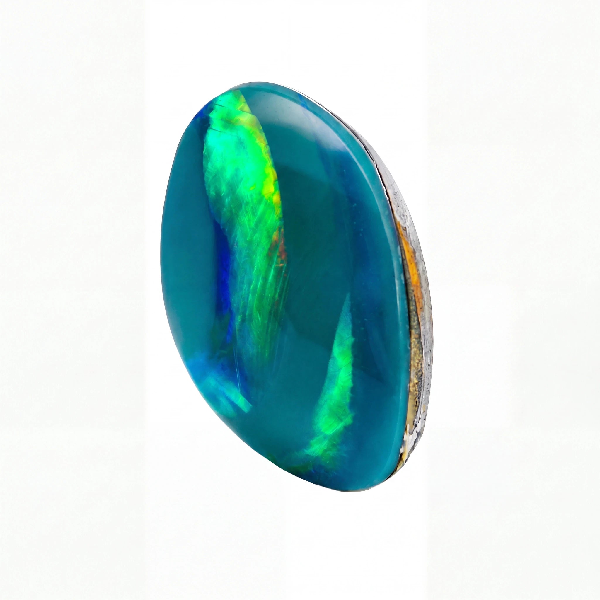 A polished oval cabochon gemstone featuring vibrant blue and green iridescent play-of-colour, set in a silver-toned bezel setting against a plain white background.
