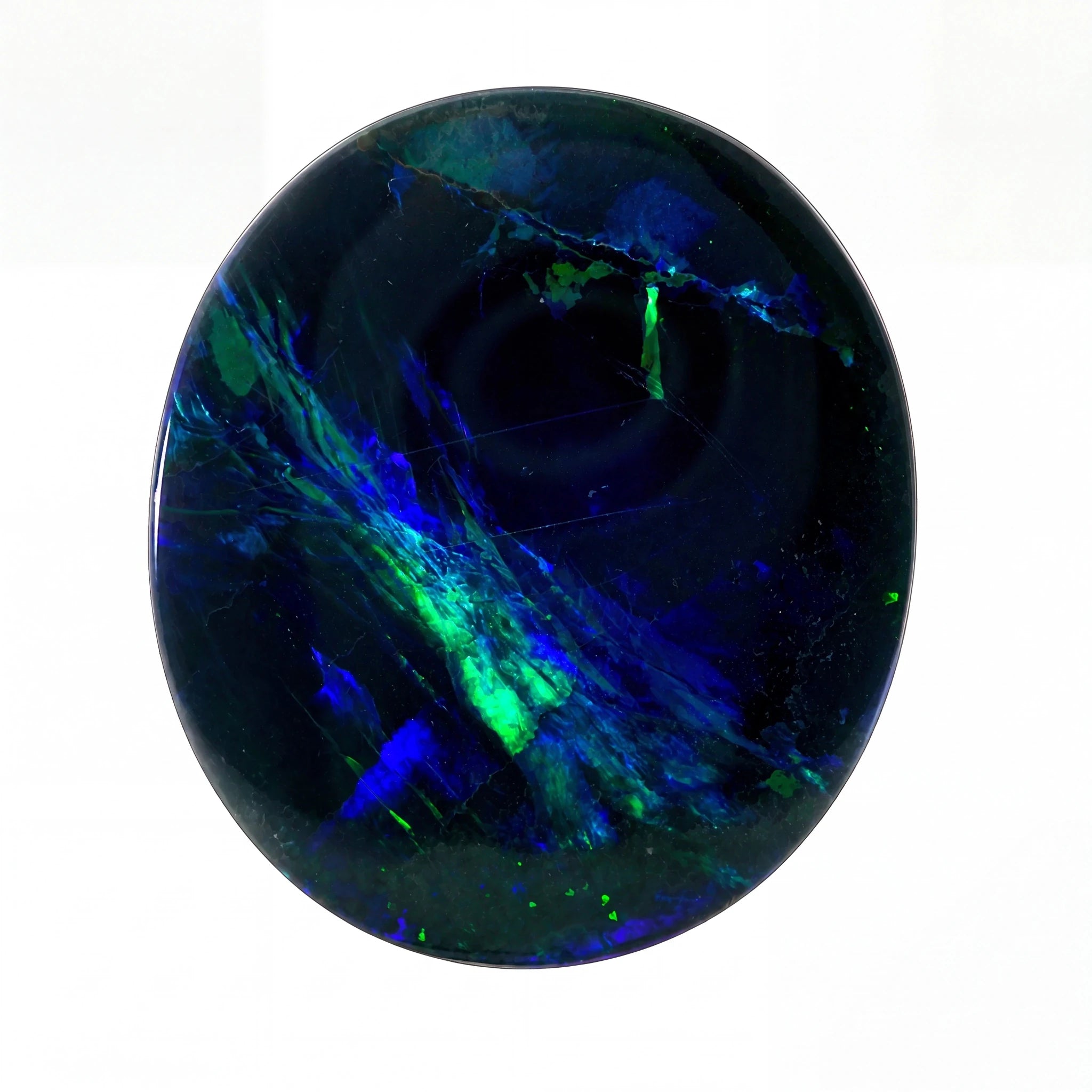 A polished oval cabochon gemstone featuring a deep black base with vibrant, swirling patterns of electric blue and neon green, set against a plain white background.