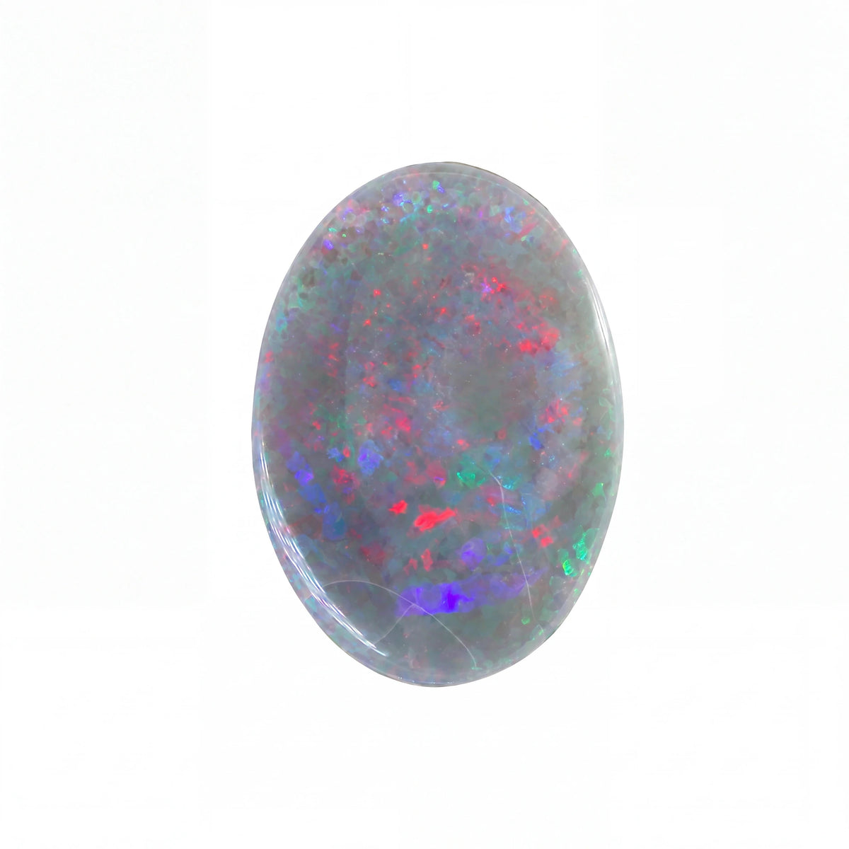 A polished oval cabochon opal gemstone displaying a play-of-colour pattern with red, blue, green, and purple flashes on a grey base, set against a plain white background.