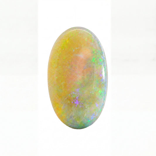 An oval cabochon gemstone showing a play-of-colour opal pattern with vibrant flashes of green, blue, purple, and yellow over a warm peach and cream base, set against a plain white background.