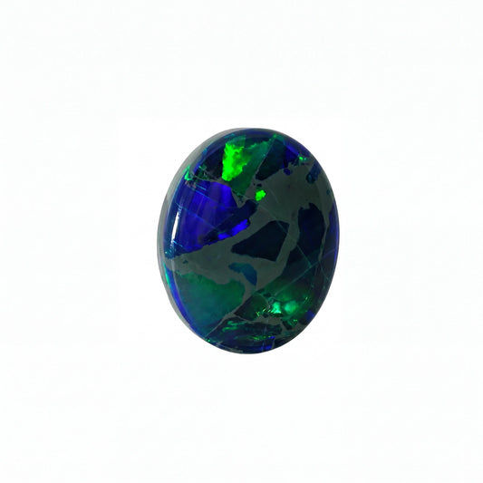 A polished oval cabochon gemstone featuring a vibrant play-of-colour with deep blue, green, and black patterns, set against a plain white background.