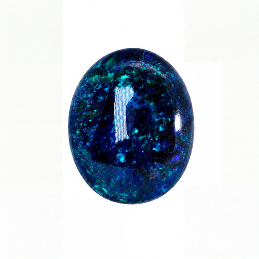 A polished oval cabochon gemstone featuring a deep blue and teal iridescent pattern, set against a plain white background.