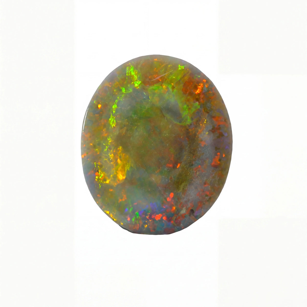 An oval cabochon gemstone showing a vibrant play-of-colour with green, orange, yellow, and blue flashes on a white background.