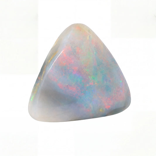 A polished triangular opal stone with iridescent colours of pink, blue, green, and yellow on a white background.