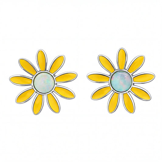 Yellow flower-shaped earrings with a central circular design on a white background