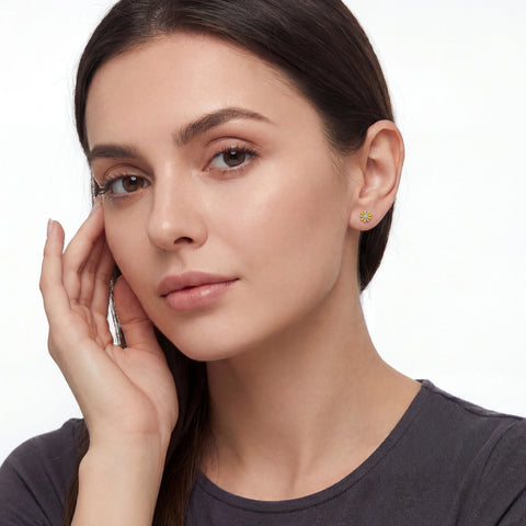 Woman wearing earrings with a neutral background
