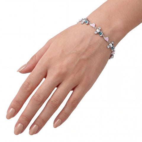 Hand wearing a bracelet with colourful beads on a white background
