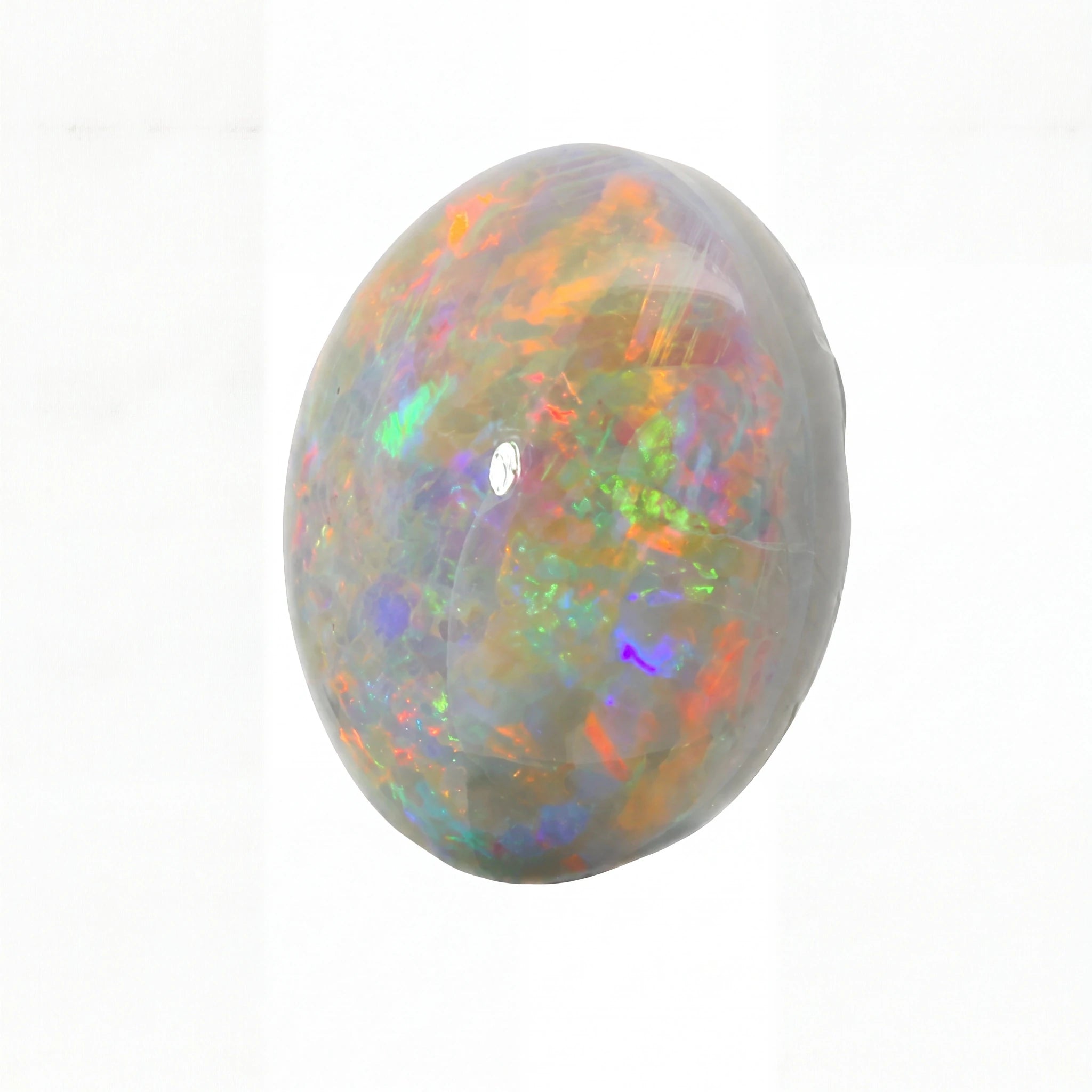 A polished oval cabochon gemstone showing a vibrant play-of-colour opal pattern with orange, green, blue, purple, and red flashes on a white background.