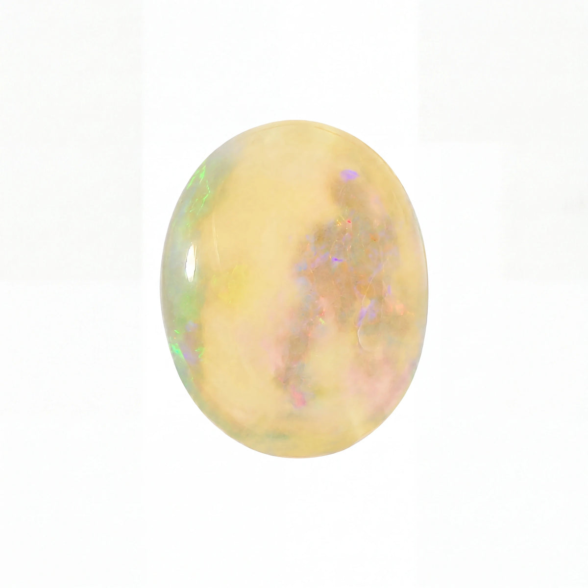 A polished oval cabochon gemstone featuring a creamy yellow base with iridescent flashes of green, blue, and pink, set against a plain white background.