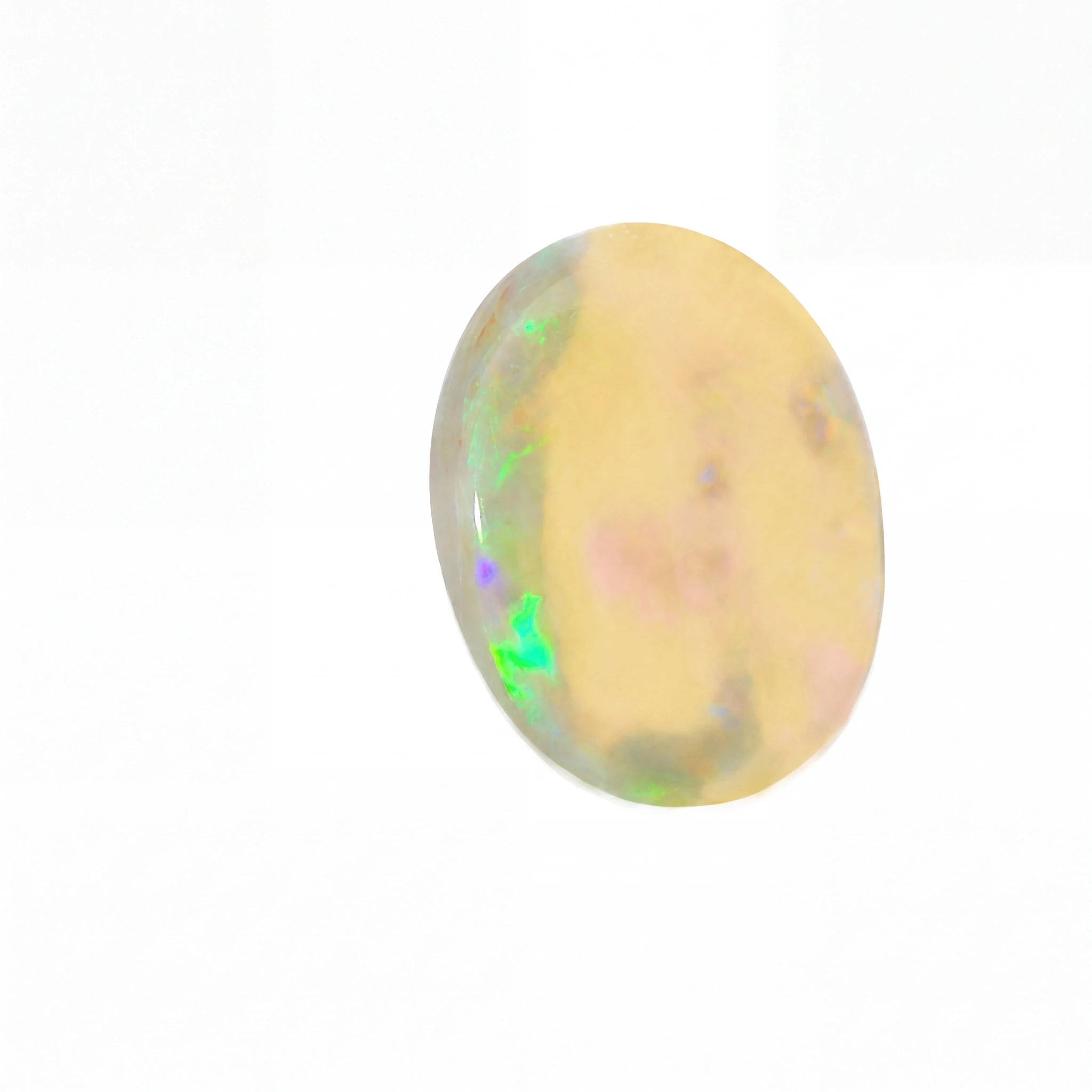 A polished oval cabochon gemstone showing a creamy yellow base with iridescent flashes of green, blue, and pink, set against a plain white background.