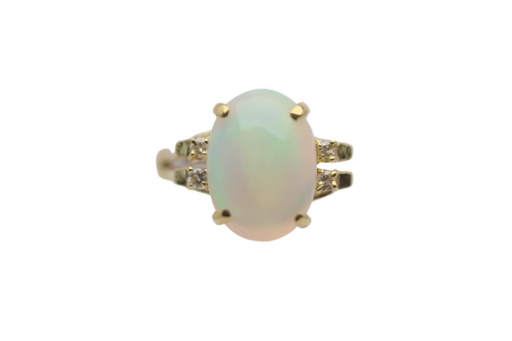 Australian Light Opal set in 18k Gold ring with 4 Diamonds