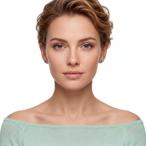 Woman wearing a light green off-shoulder top against a white background