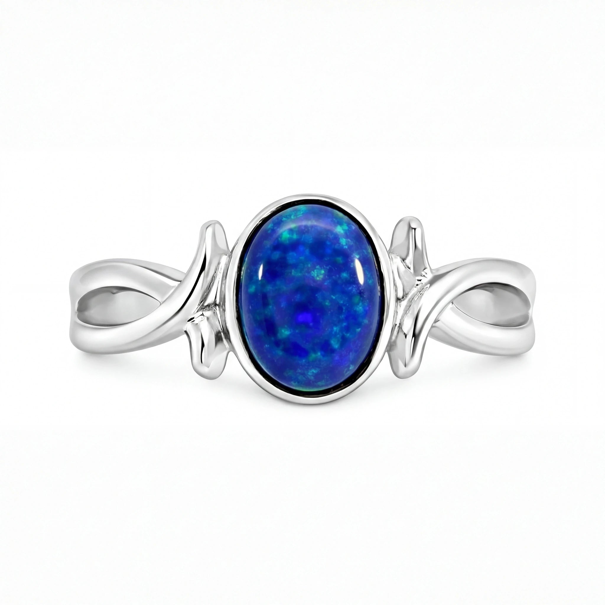 Silver ring with a blue opal stone on a white background