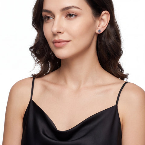 Woman wearing blue opal earrings
