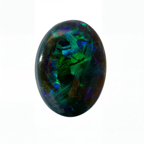 A polished oval cabochon gemstone featuring vibrant iridescent colours including green, blue, purple, and orange on a dark base, set against a plain white background.