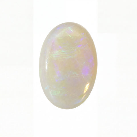 Opal gemstone with multicoloured play of light on a white background