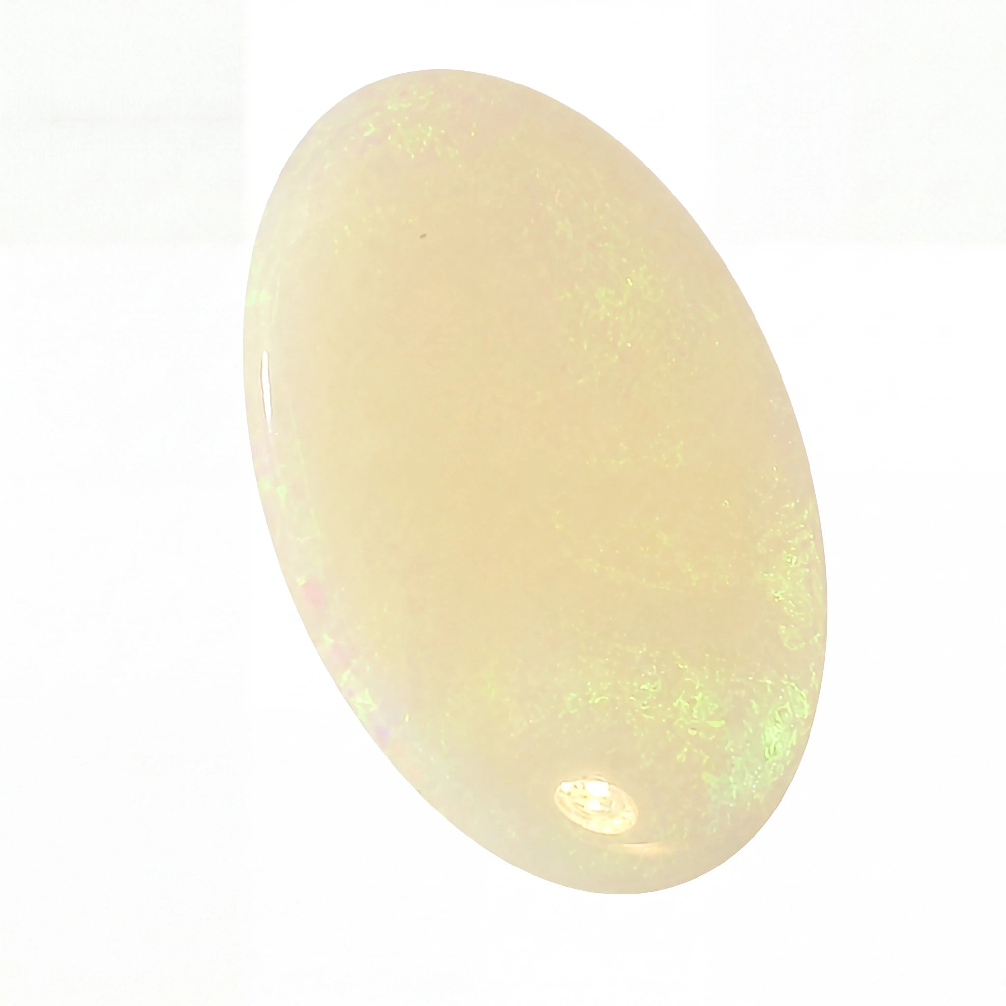 Opal stone with green fluorescence on a white background