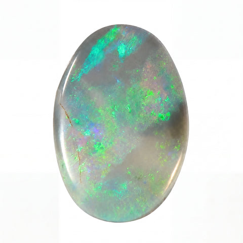 Oval-shaped opal stone with green and blue fluorescence on a white background