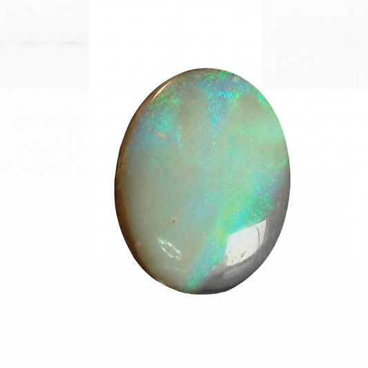 Opal stone with multicoloured play of colours on a white background