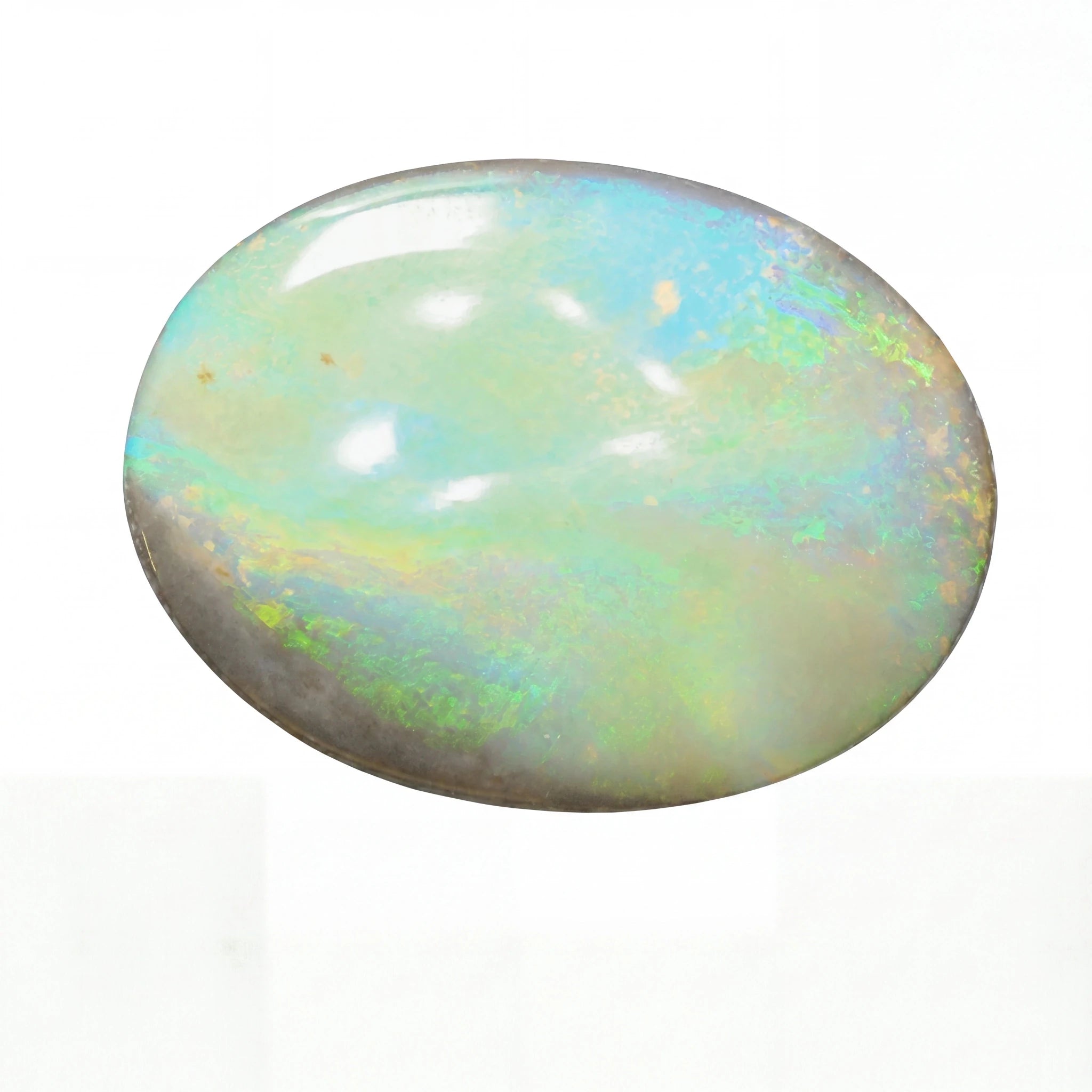 Multicoloured opal stone on a white background