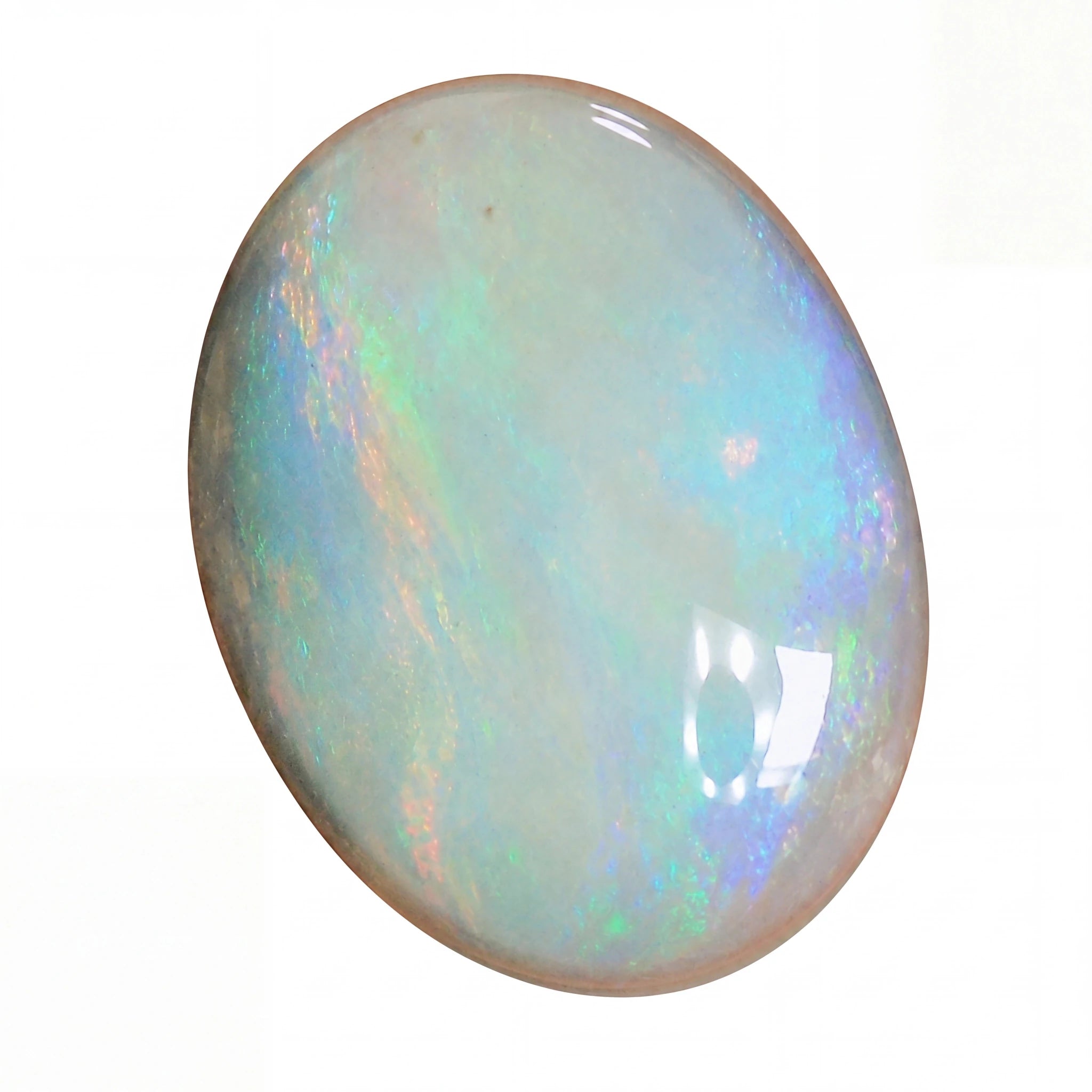 Opal gemstone with multicoloured play of light on a white background