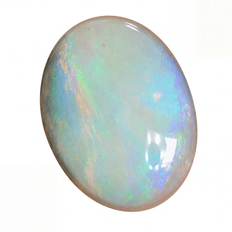 Opal gemstone with multicoloured play of light on a white background