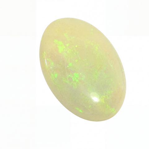 Opal stone with green fluorescence on a white background