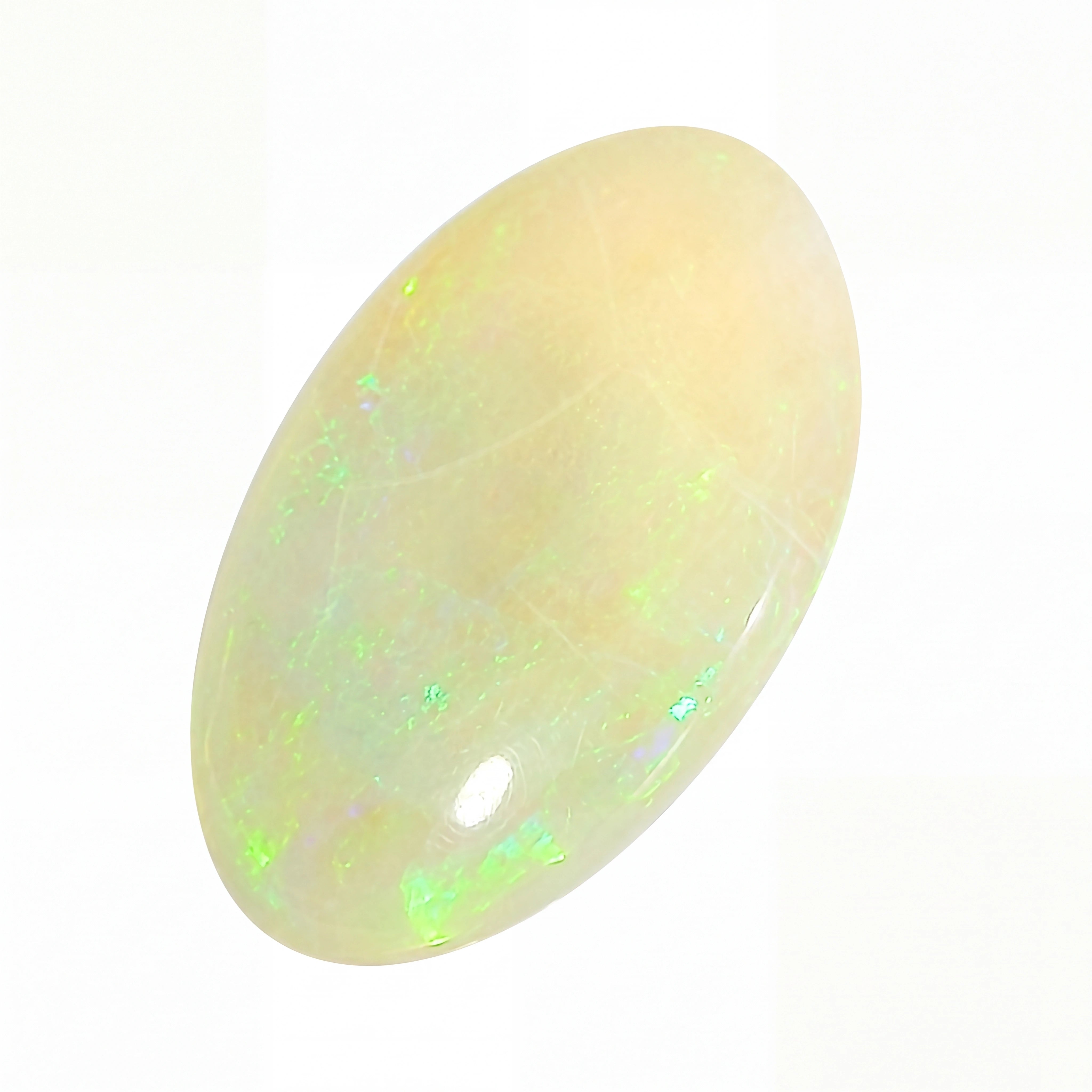 Opal stone with green and white colours on a white background