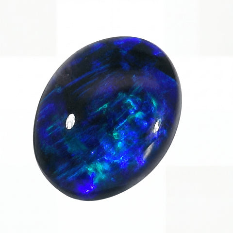 Blue and green gemstone on a white background