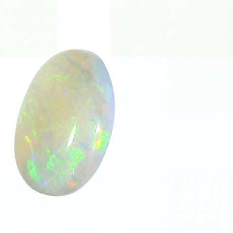 Opal stone with green and white colours on a white background