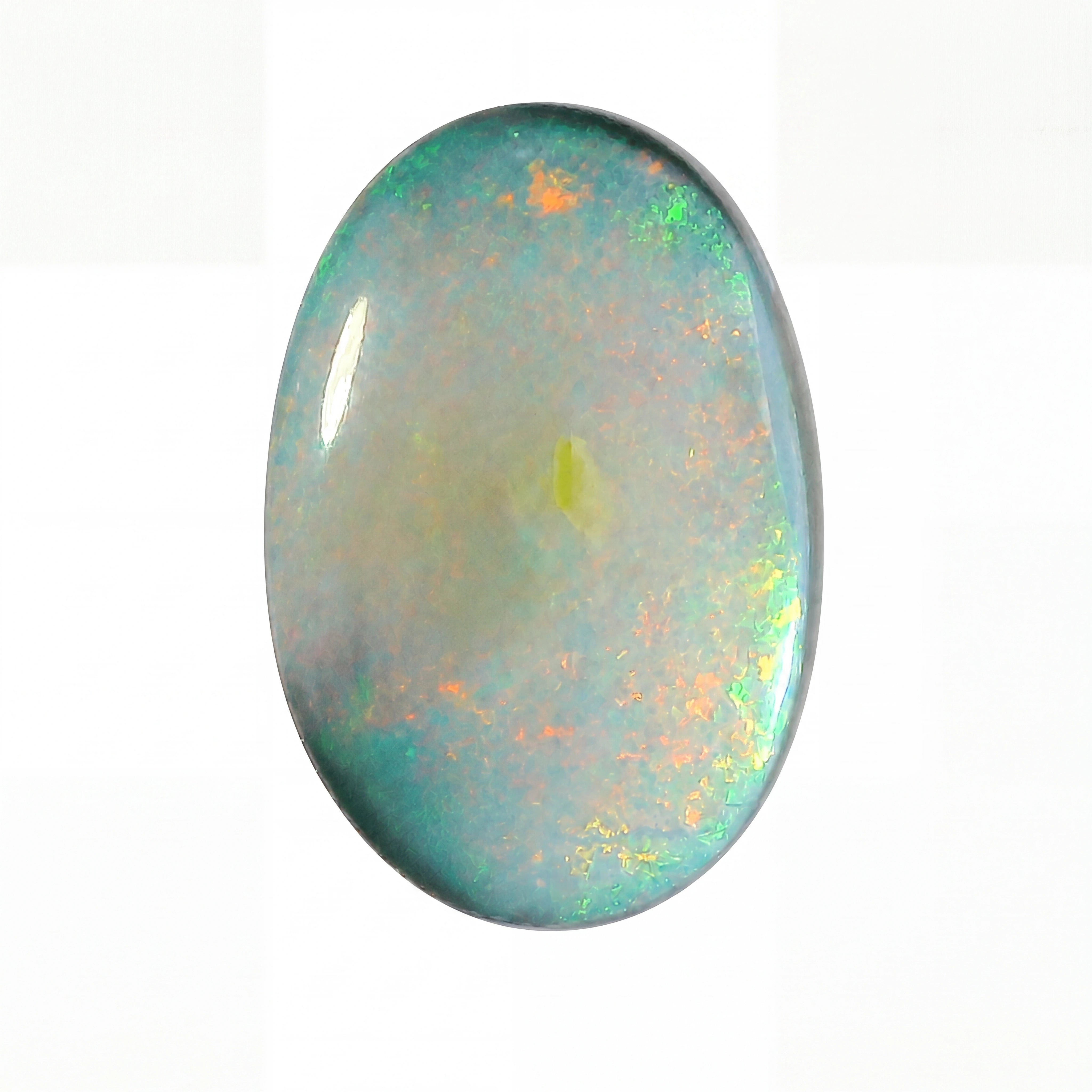 Oval-shaped opal gemstone with multicolour play of light on a white background
