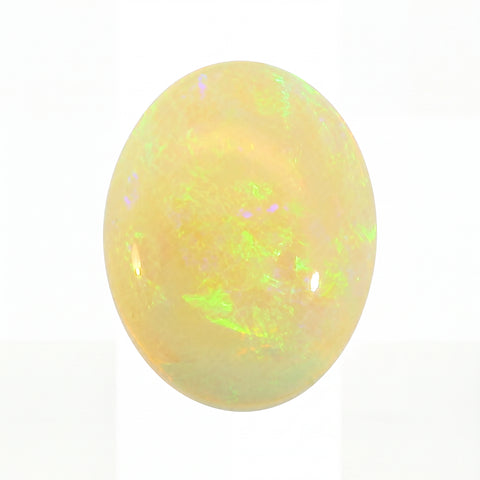 Opal stone with multicoloured play of light on a white background