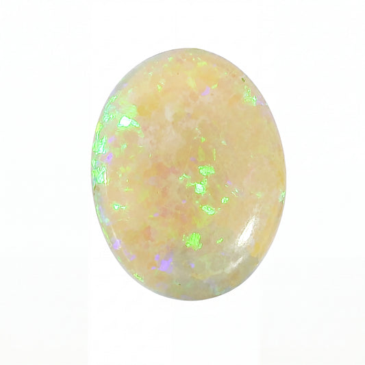 Oval-shaped opal stone with a white background