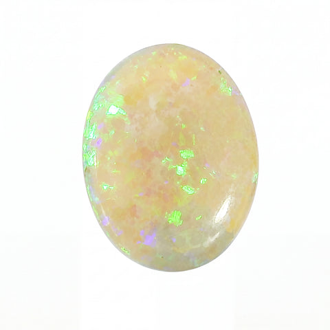 Oval-shaped opal stone with a white background