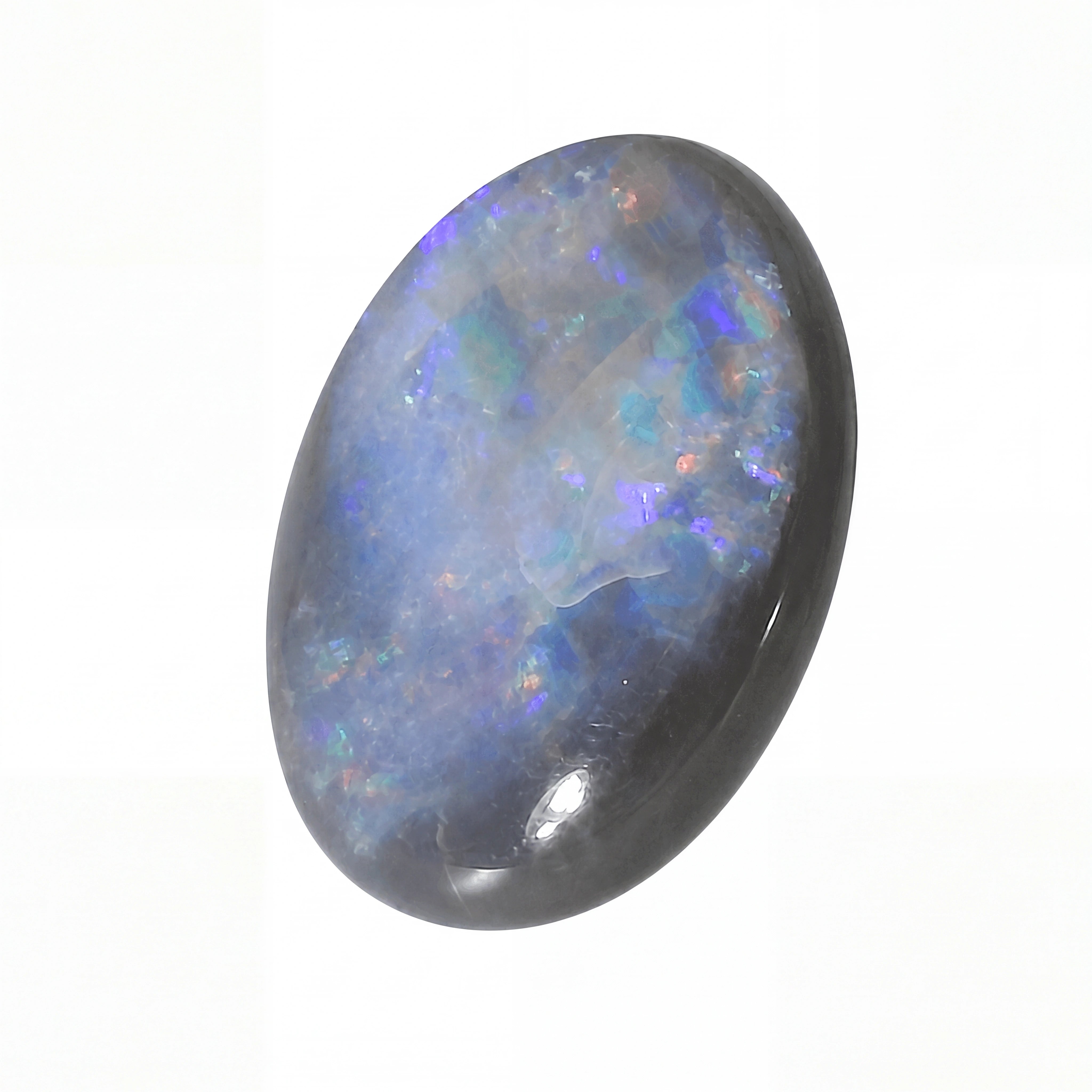 Opal stone with multicoloured play of colours on a white background